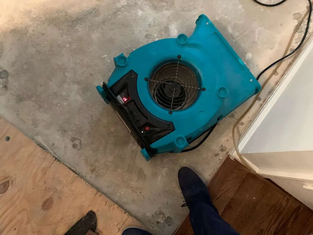 Air mover drying subfloor during Leak Detection & Repair in Schenectady